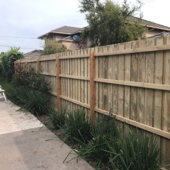 Timber fence behind residential units