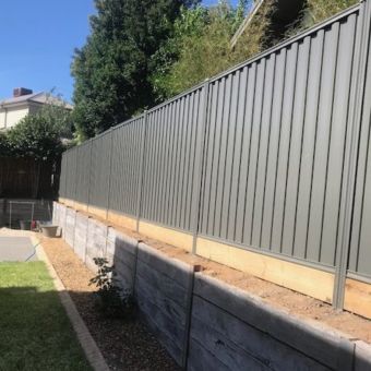 Colorbond fence with base timber sleepers Berwick