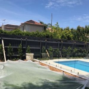 Outside-pool-glass-fence-located-Brighton-by-Ash-and-El-fencing_340x340_acf_cropped